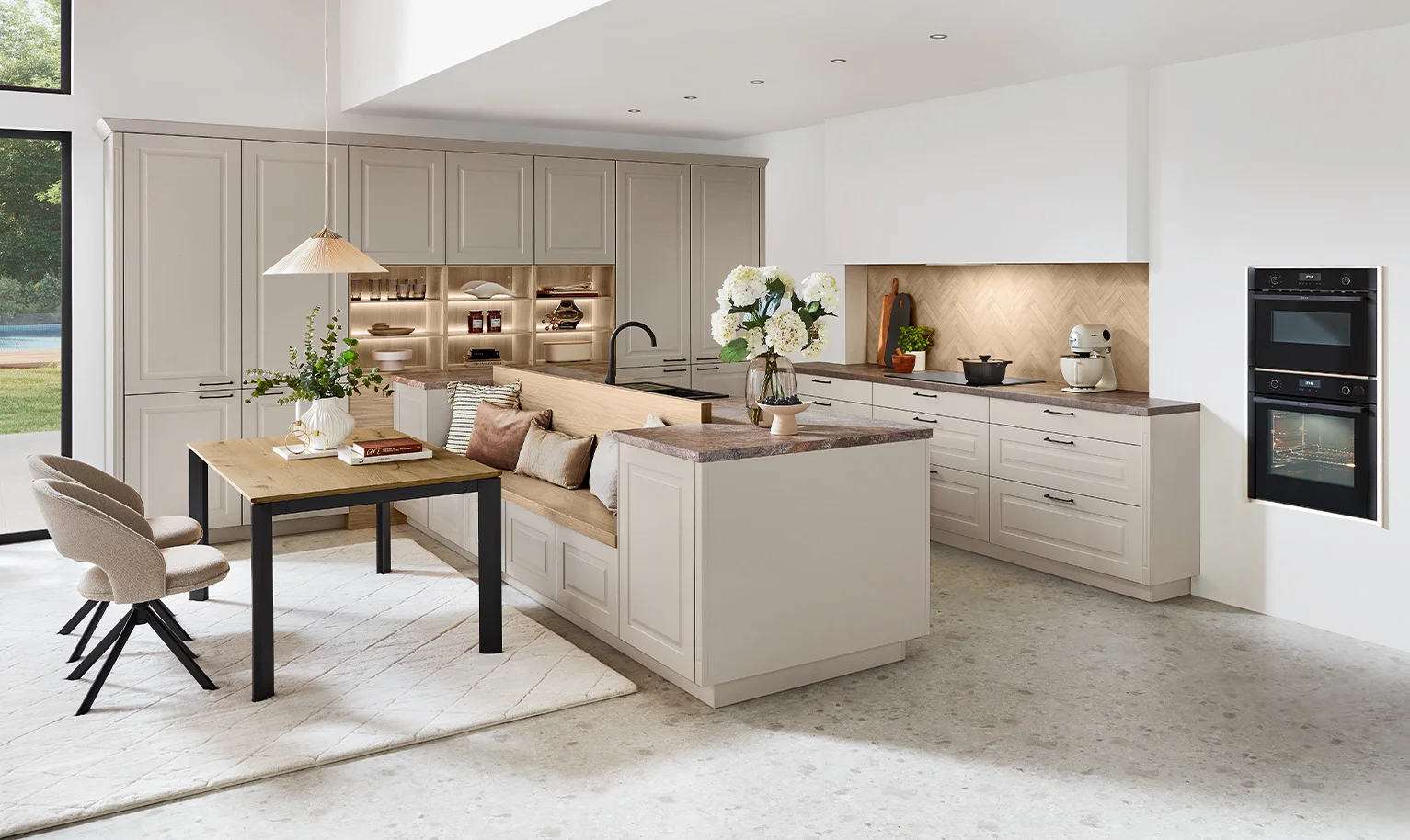 SYLT country house kitchen in Sand Perfect matt with comfortable bench seat and plenty of storage space.